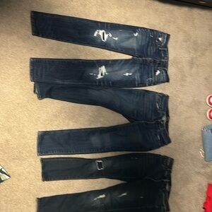 Selling three ripped jeans, American eagle, hollister, and express
